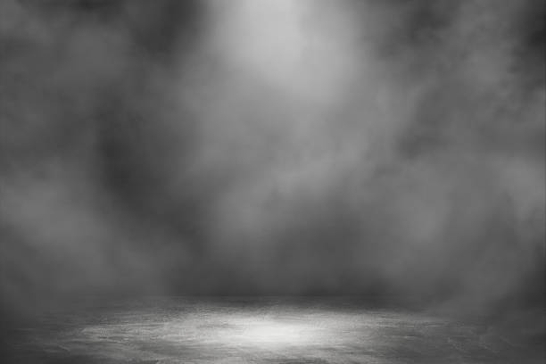 istock Empty space studio dark room with spot lighting and fog in black background. 1222578342
