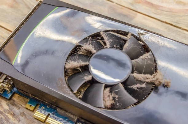 Dusty video card from a computer close up on a wooden background
