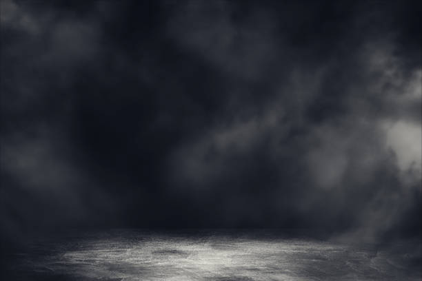 istock Empty space studio dark room with spot lighting and fog in black background. 1222578432