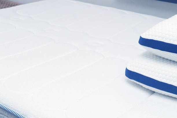 istock Orthopedic pillow on the quilted mattress. Comfortable bed for sleep and rest 1222580179