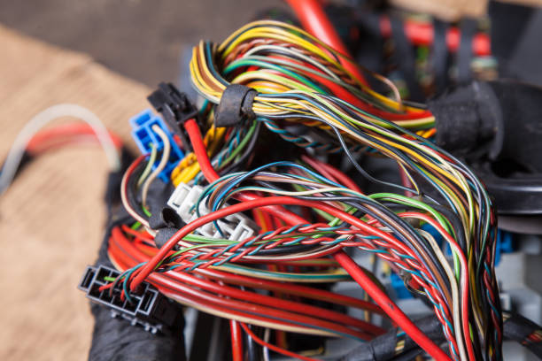 istock A bunch of multi-colored electrical wires interconnected in the nodes of a car during network repair by an engineer or mechanic in a service or workshop. 1222580418