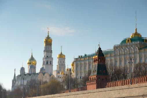 The Moscow Kremlin is reflected in the Moscow River.