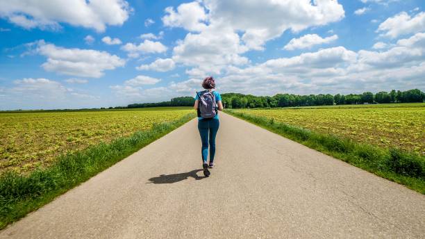 istock A female hiker walks amongst farm fields 1222580538