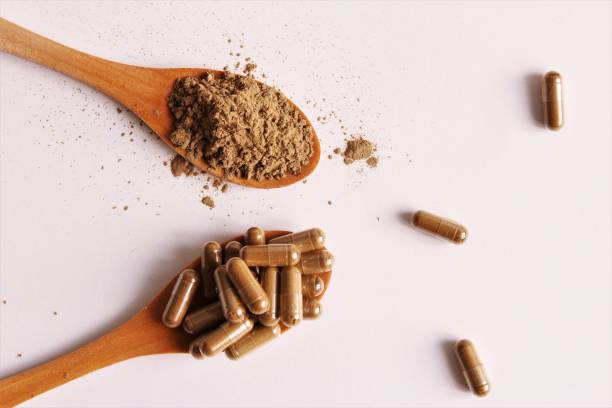 istock Capsules and powder of herb medicines 1222581470
