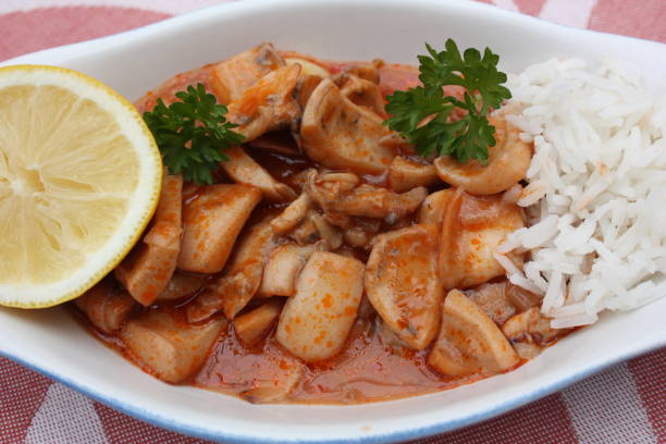 istock Cuttlefish cooked in a stew with Armorican sauce Meal served with white rice cooked in water 1222582880