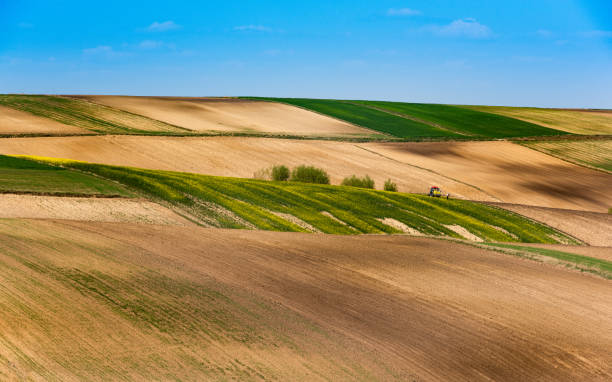 istock Colorful Farmfields in Coutryside. Farmland and Fields at Rolling Hills 1222583317