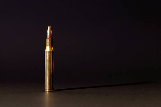 7.62 mm Caliber Bullet Isolated on Black Background stock photo