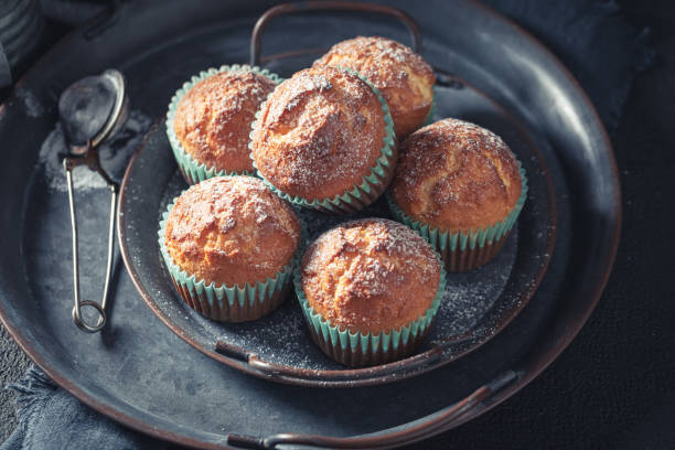 istock Sweet and hot vanilla cupcakes on rustic dark table 1222587610