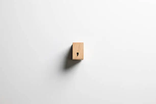 " the comma " text made of wooden cube on  White background with clipping path.