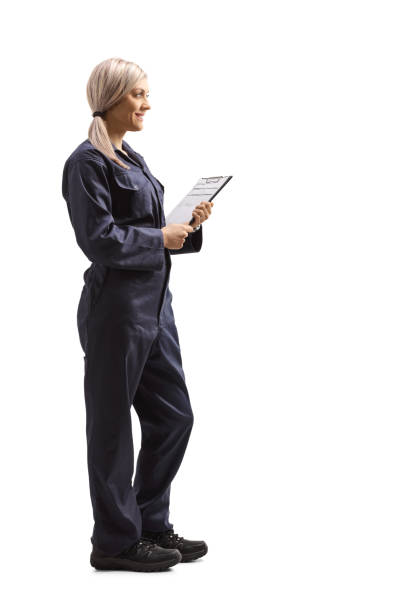 istock Female worker in an overall uniform holding a clipboard with a document 1222588563