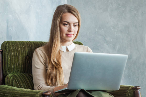 istock Young woman using laptop at home 1222589284