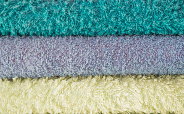 istock stack clean bath towels colorful cotton terry textile background. Spa and cozy home concept. copy space for text 1222589313