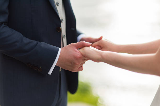 istock Man holding hands of his wife 1222590680