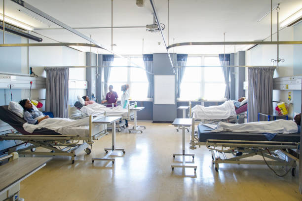 istock Open Plan Medical Hospital Ward Doctor Visits 1222592721