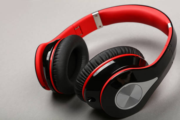 istock Close up modern red headphones on gray table 1222593087