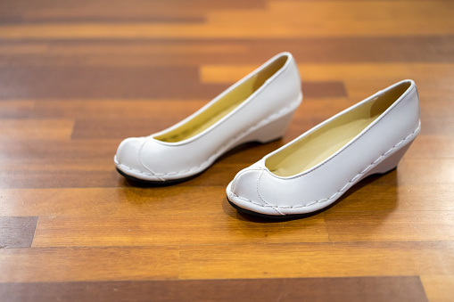 Korean wedding shoe for bride on wooden floor