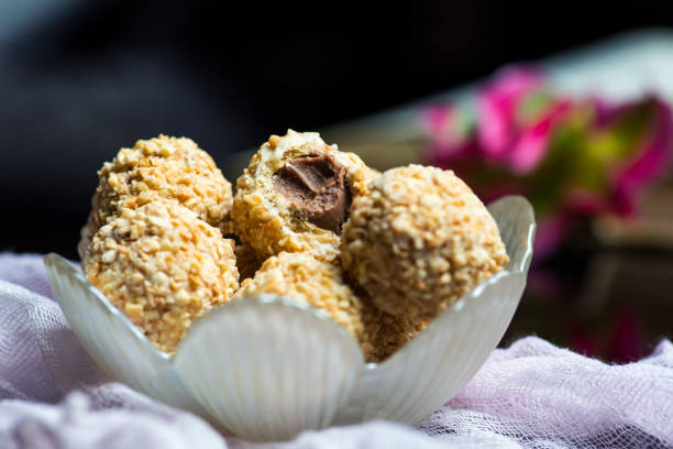 Homemade balls dessert sprinkled with hazelnut stuffed with chocolate