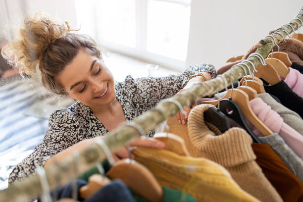 istock Young woman choosing clothes 1222596078