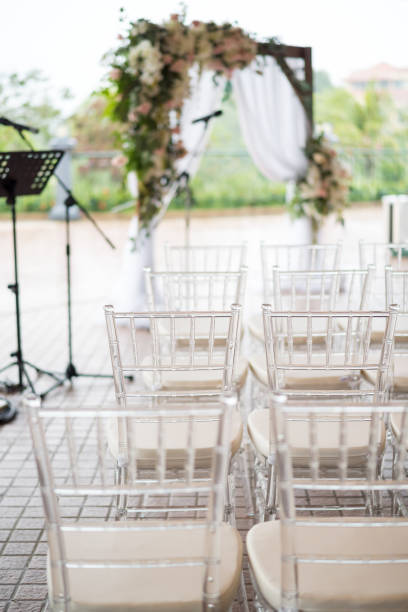 istock Rows of transparent chairs at open space wedding ceremony 1222596110