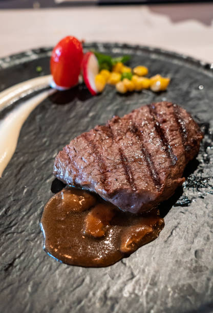 istock Delicious medium rare wagyu beef  steak with gravy sauce. 1222596289
