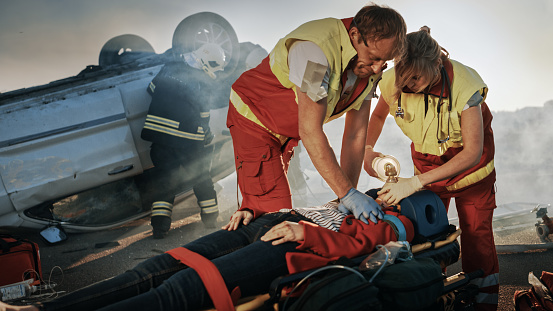 First Aid, Traffic Accident, Medical Worker Intervening with Oxygen Mask in Ambulance