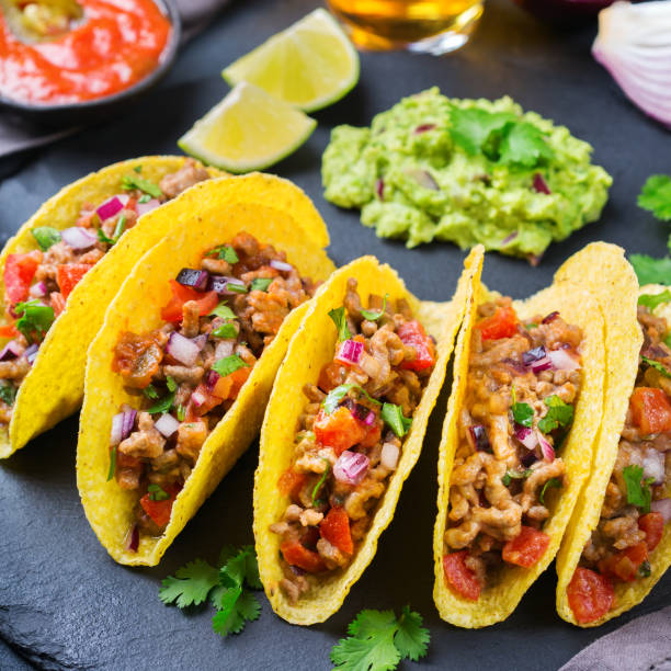 istock Taco shell nachos with beef, guacamole, chili, cheese salsa, tequila 1222599570