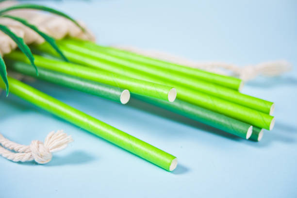 istock Eco friendly green paper straws in a cotton sack. Ecological concept. Zero waste. Top view. 1222600231