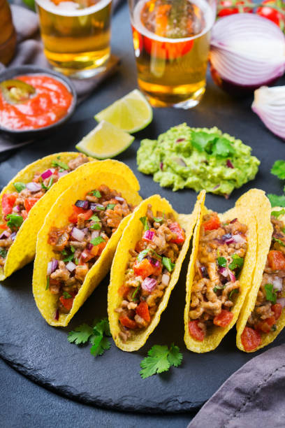 istock Taco shell nachos with beef, guacamole, chili, cheese salsa, tequila 1222602160
