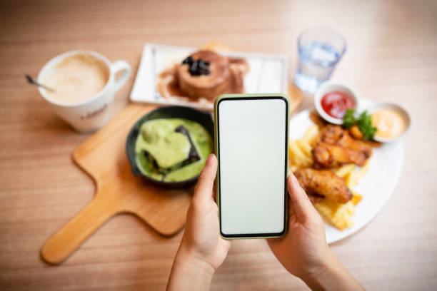 istock Woman was using smart phone and eating breakfast. 1222602950