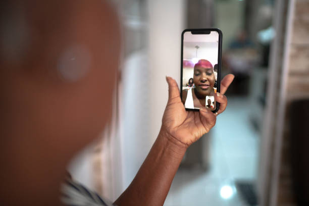 istock Mobile screen with a woman on video chat at home 1222604162