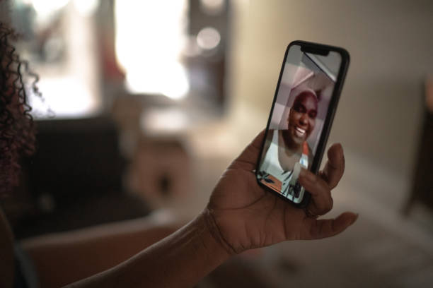 istock Mobile screen with a woman on video chat at home 1222604257