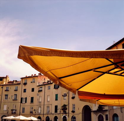Piazza dell'Anfiteatro, Lucca, in a sunny day under an \