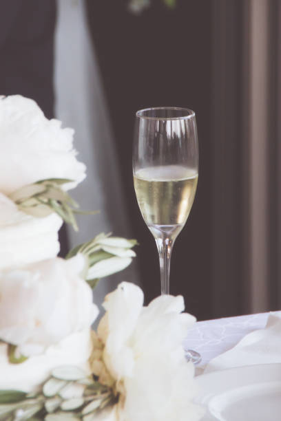 istock Champagne flute next to flowers 1222605863