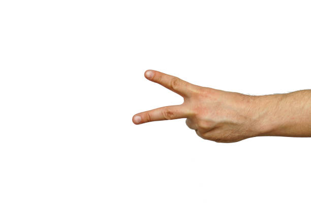 istock Hand with the symbol of scissors, two fingers forward on a white background isolated 1222606513