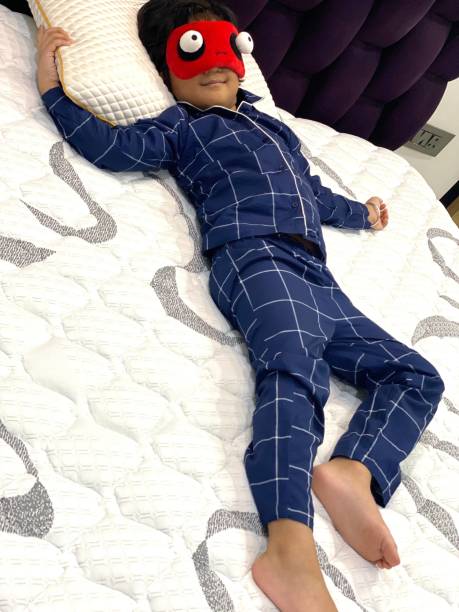 Energetic Young Boy has to face his Bedtime A young boy from India is having difficulty going to sleep at bedtime.  Stated Simply, he just has too much Energy and he wants to extend his Playtime. indian boy barefoot stock pictures, royalty-free photos & images