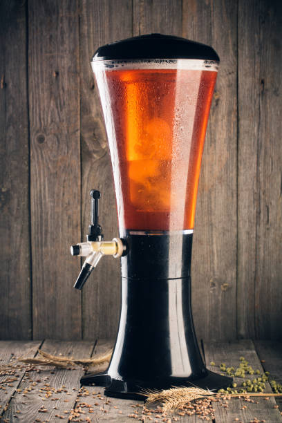 Beer tower with hop, malt and wheat on wood background Beer tower with hop, malt and wheat on wood background. Vertical composition change dispenser stock pictures, royalty-free photos & images