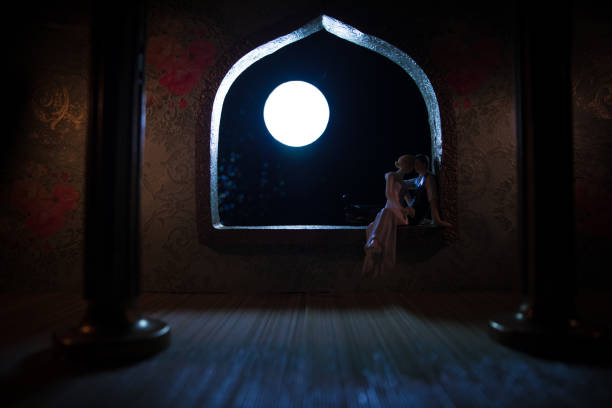 istock Beautiful arabian interior realistic miniature. Table decoration. Romantic couple at window. 1222610246