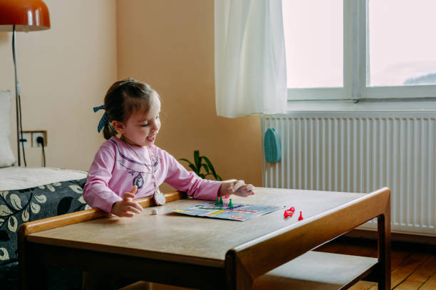 Child playing board game at home