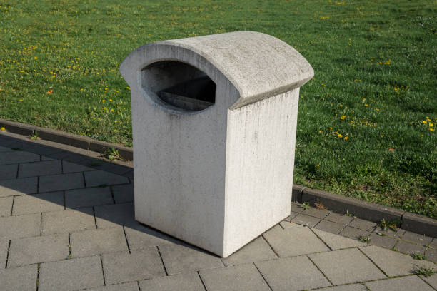 istock Concrete dustbin on a sidewalk in the town 1222612054