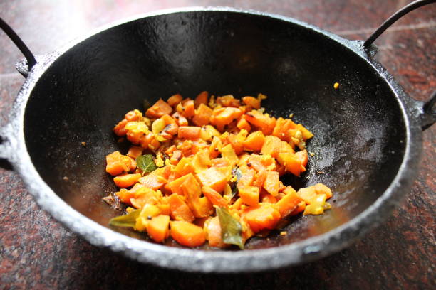 istock Carrot thoran in a traditional iron pot. 1222612348