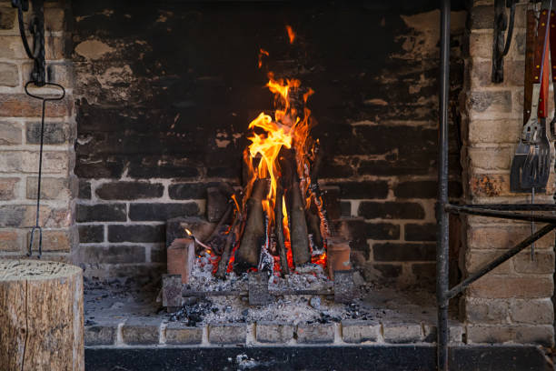 istock Fireplace with a burning fire, comfort and atmosphere. 1222615326