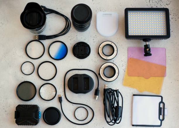 istock Flat lay composition with equipment for professional photographer on grey background. 1222617220