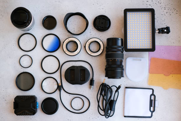 istock Flat lay composition with equipment for professional photographer on grey background. 1222617254