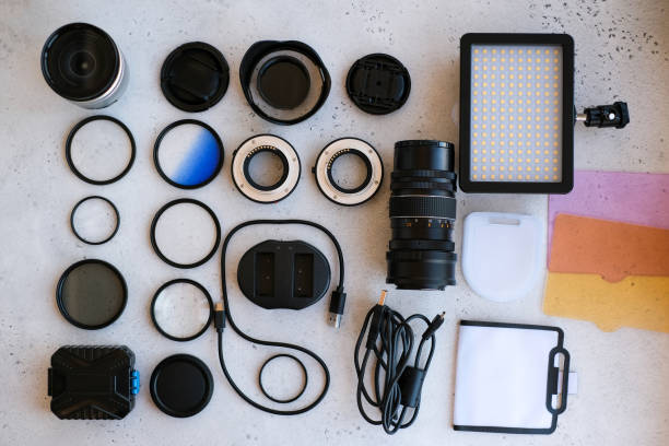 istock Flat lay composition with equipment for professional photographer on grey background. 1222617278