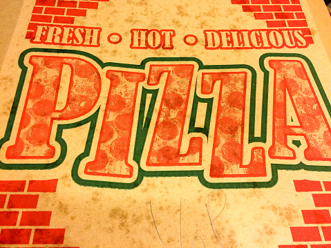 Classic pizza box cardboard with red letters fresh hot delicious