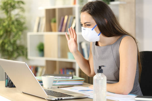 istock Happy entrepreneur greets on videocall on coronavirus confinement 1222617788