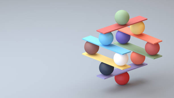 jenga juego torre de bloque de color con bolas - concept fotografías e imágenes de stock