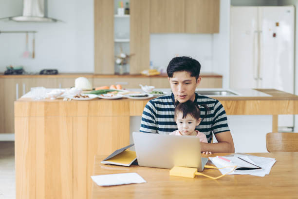 istock Father Working at Home With a Small Child 1222619110