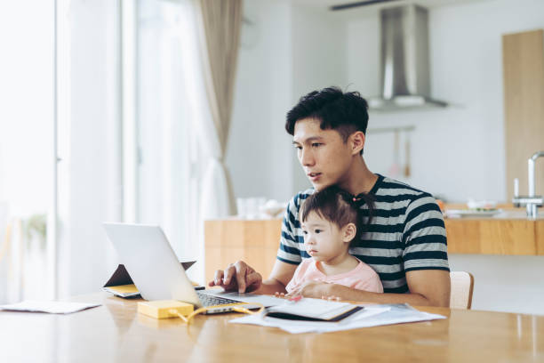 istock Father Working at Home With a Small Child 1222619127