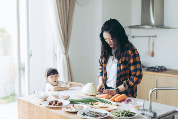 istock Mother cooking with her daughter in the kitchen 1222619250